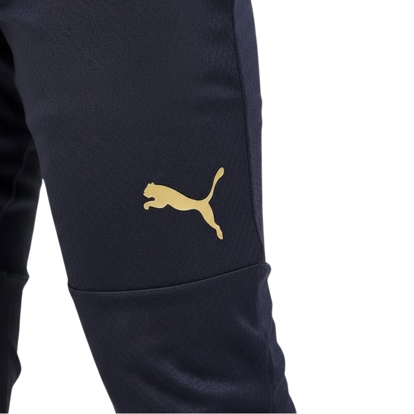 Navy blue pants with a gold Puma logo on a white background