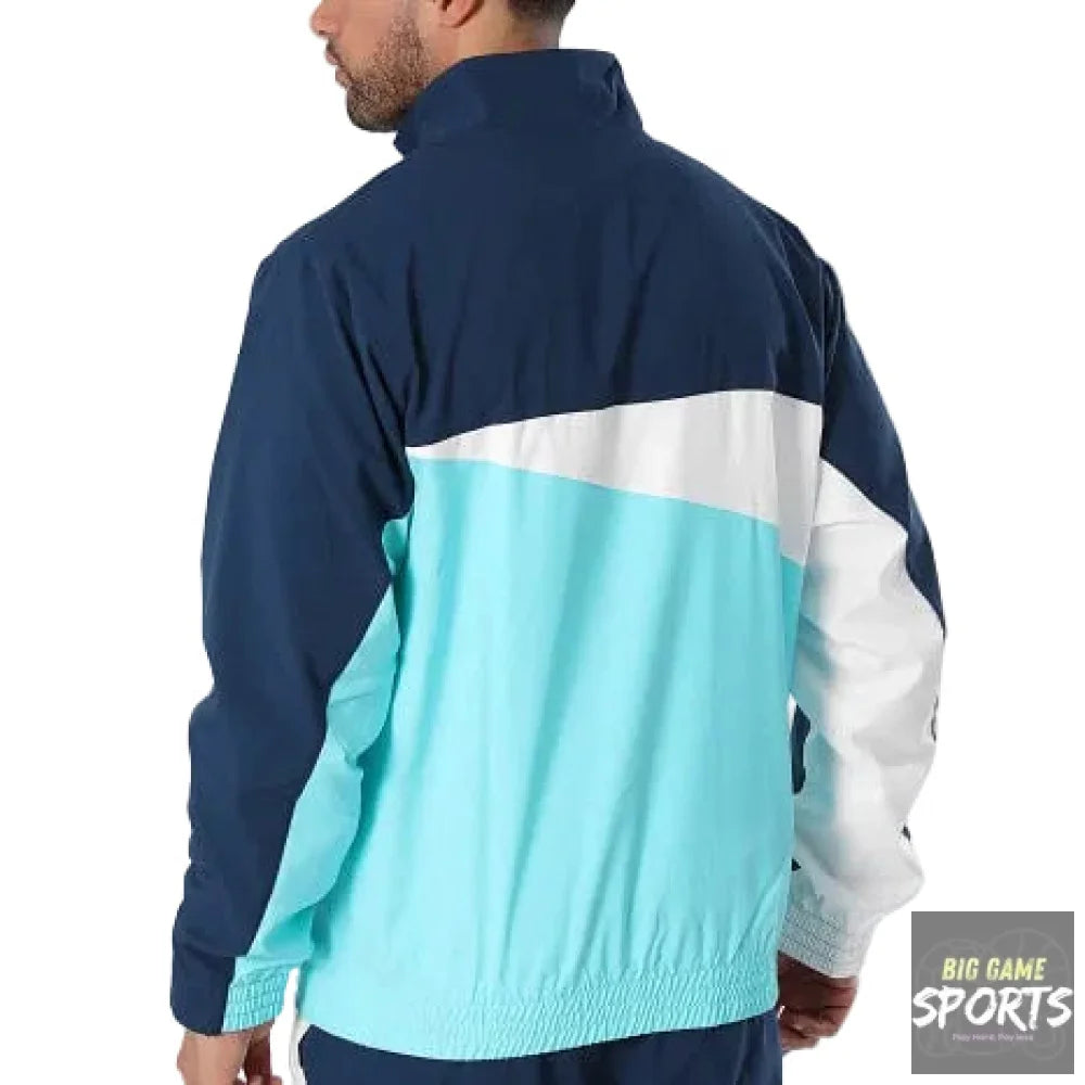 A man shown from the back wearing a colorblock windbreaker jacket with navy blue, light blue, and white panels, photographed against a clean white studio background.