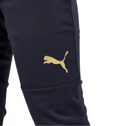 Navy blue pants with a gold Puma logo on a white background