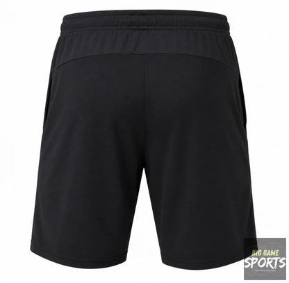 Black athletic shorts shown from the back, featuring an elastic waistband and side pockets, on a solid white background.