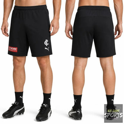 Black Puma soccer shorts shown from the front and back on a model, featuring a white club crest and Puma logo on the front, and a red 'STROBE' sponsor patch on the left side.