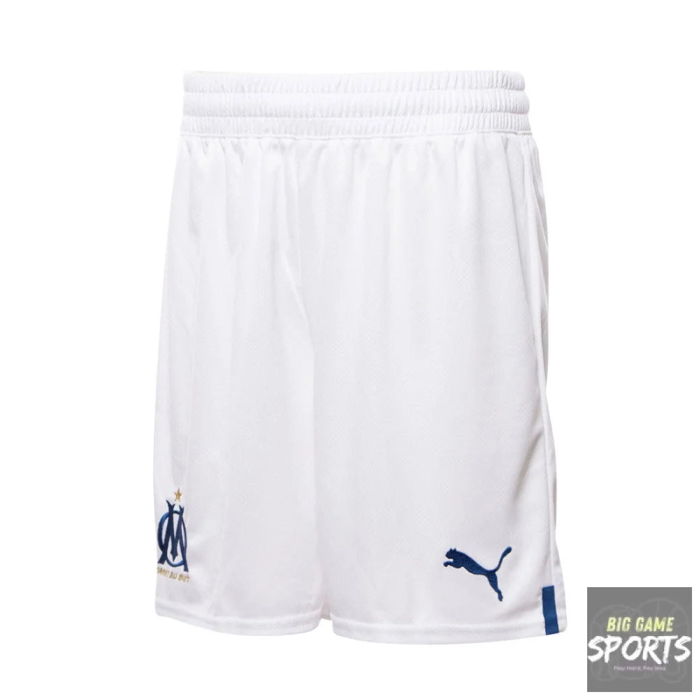 White Puma Olympique de Marseille athletic shorts with a navy blue logo on the left leg and a navy blue Puma cat logo on the right leg, shown against a plain white background.