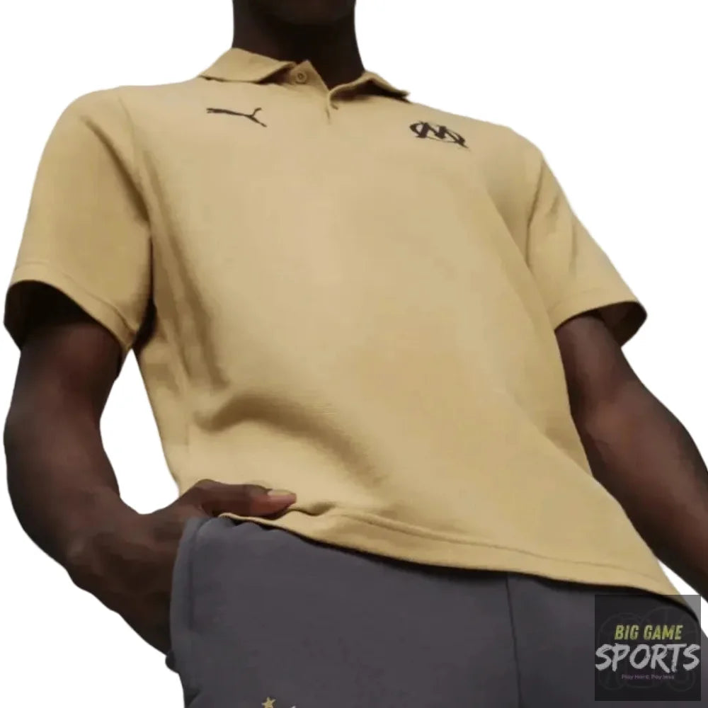 Person wearing a beige polo shirt and dark gray shorts with logos on a white background