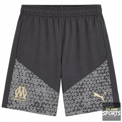 Dark gray athletic shorts featuring a geometric patterned lower panel in gray, with a gold Olympique de Marseille crest on the left leg and a gold Puma logo on the right leg.