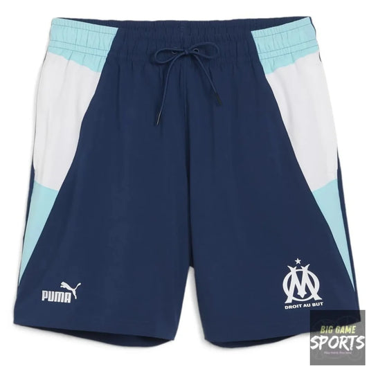 Navy shorts with light blue and white accents featuring Puma and Olympique de Marseille logos on a white background.