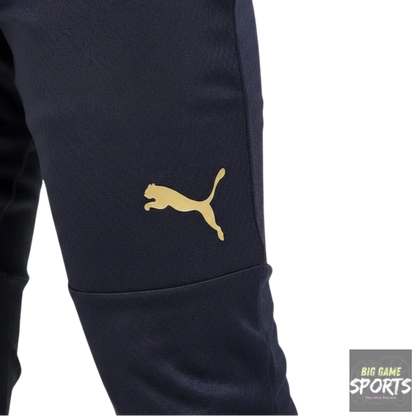 Navy blue pants with a gold Puma logo on a white background
