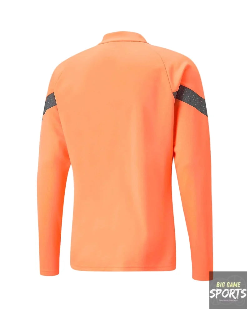 Orange long-sleeve shirt with black accents on a light gray background